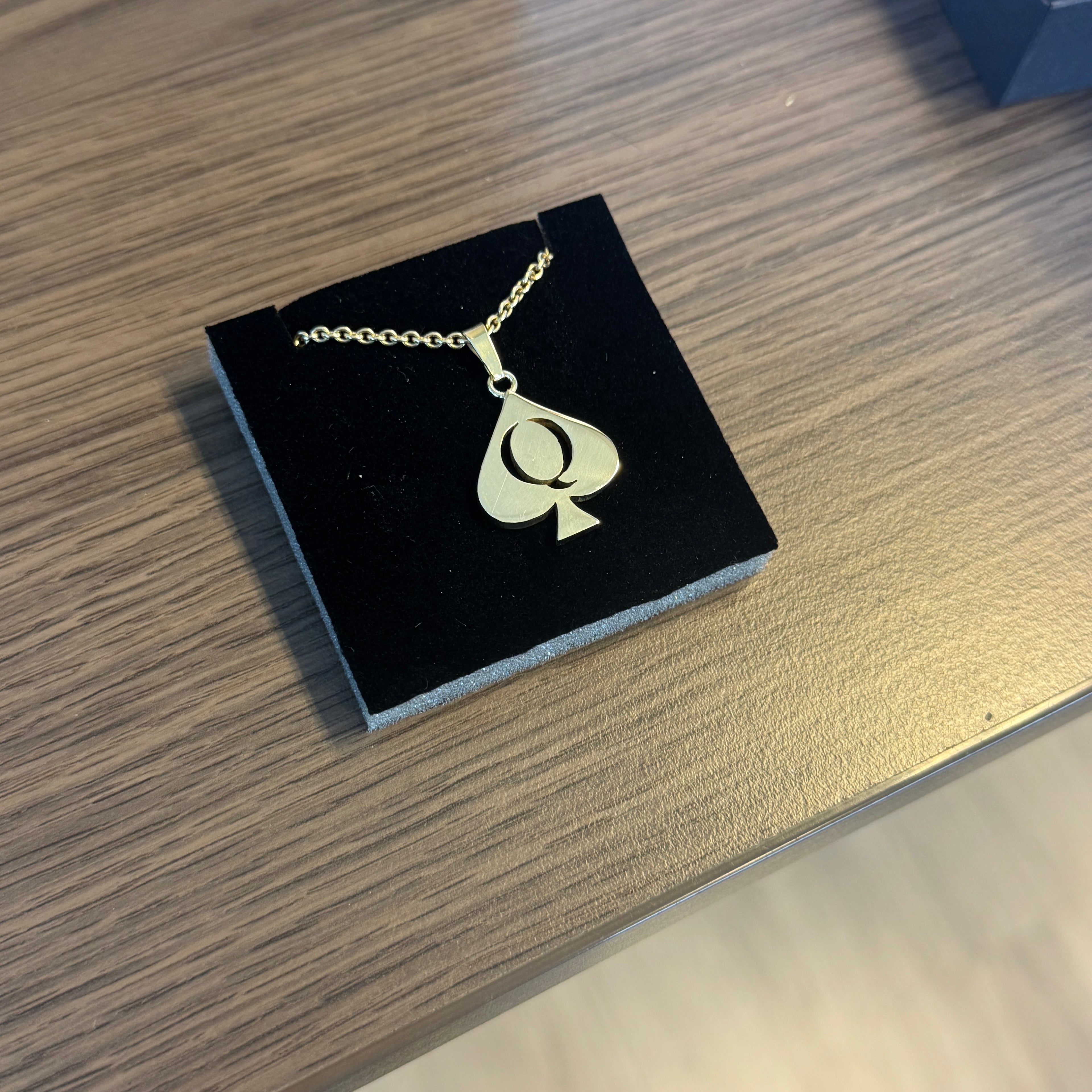 Queen of Spades in gold