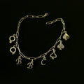 The QoS Charm in gold